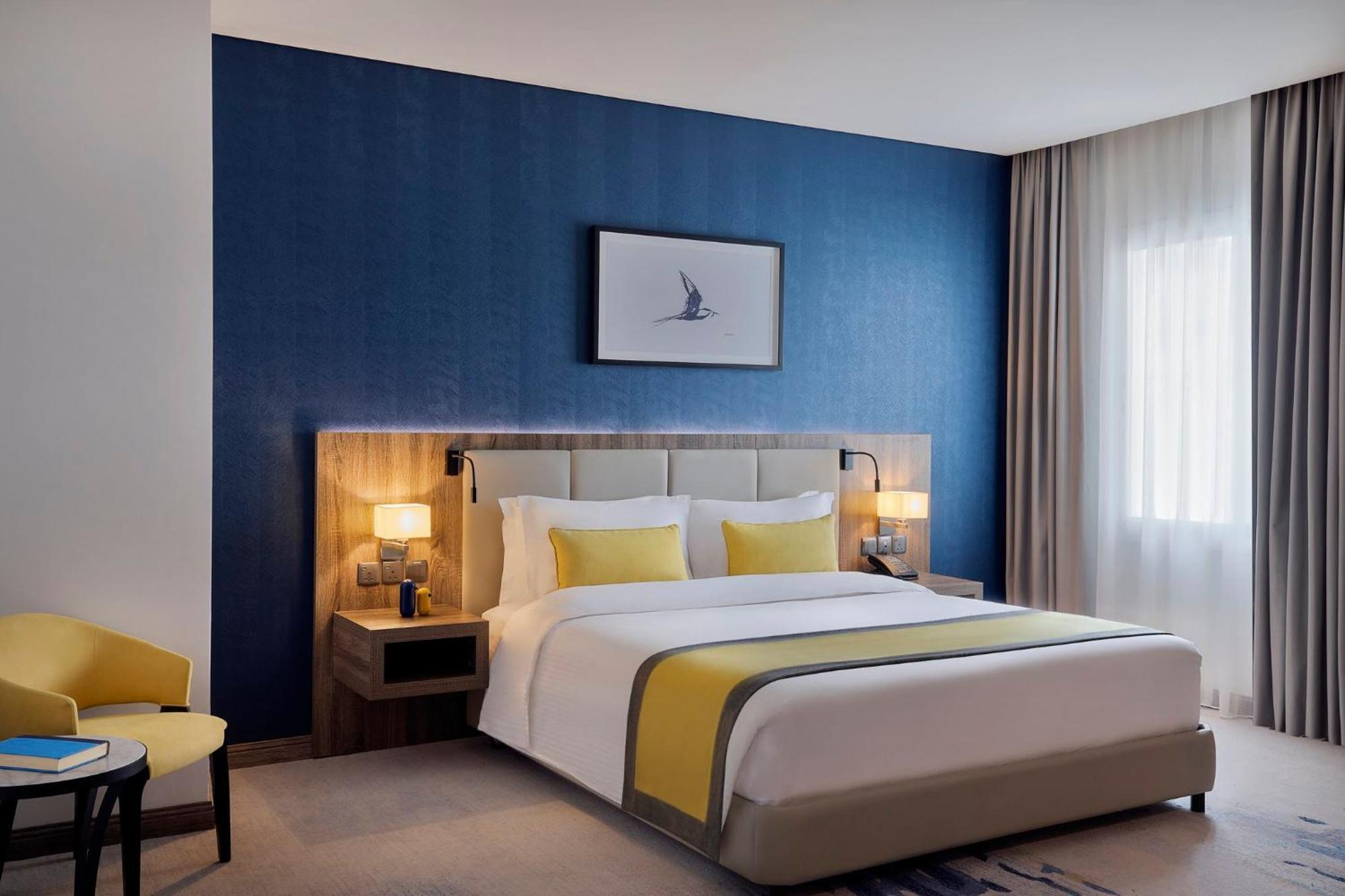 Voco Al Khobar By Ihg Exterior foto A bedroom at the hotel